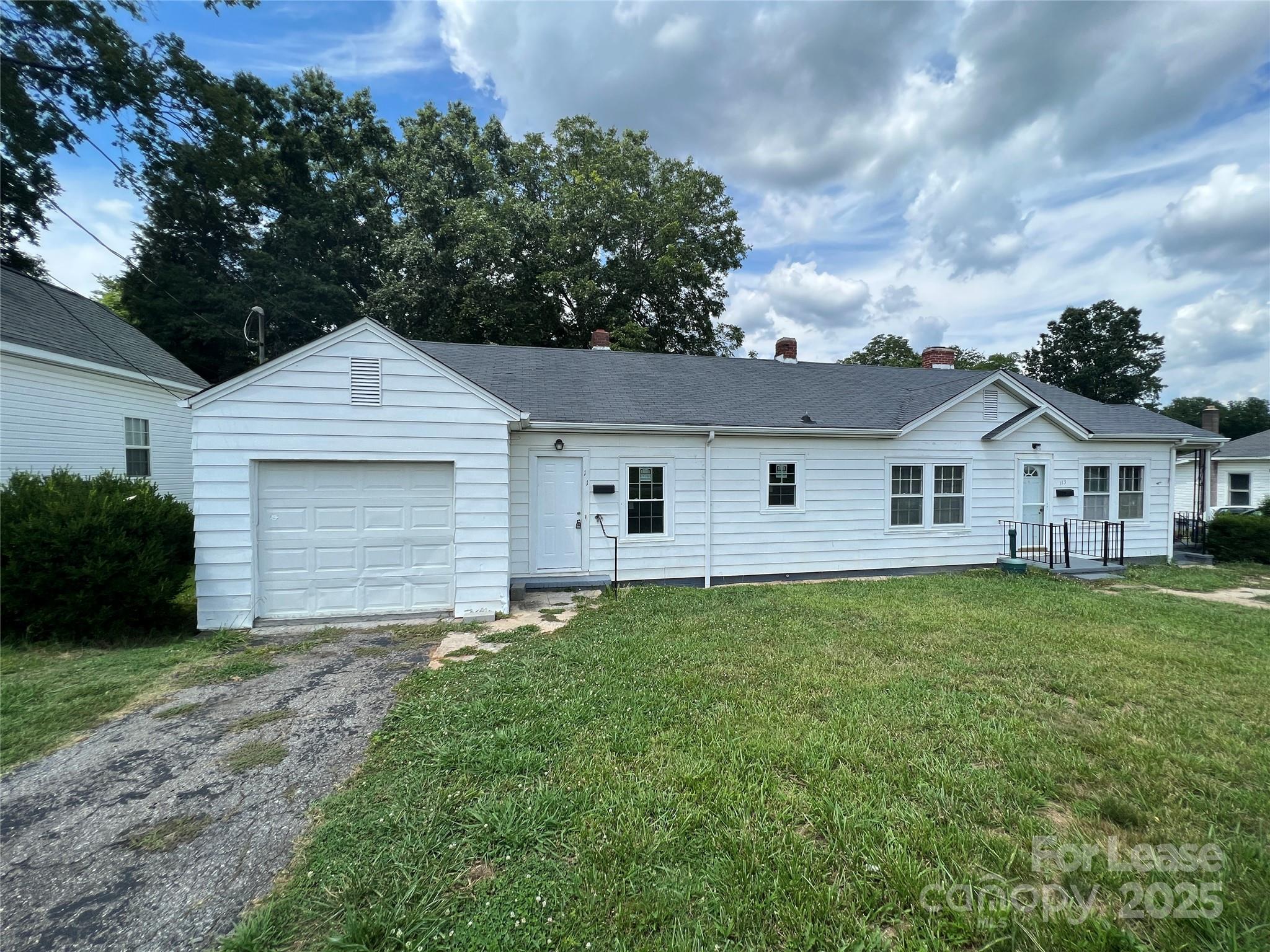 111 East Maryland Avenue Bessemer City, NC 28016 - Photo 1 of 11 a front view of house with yard and green space