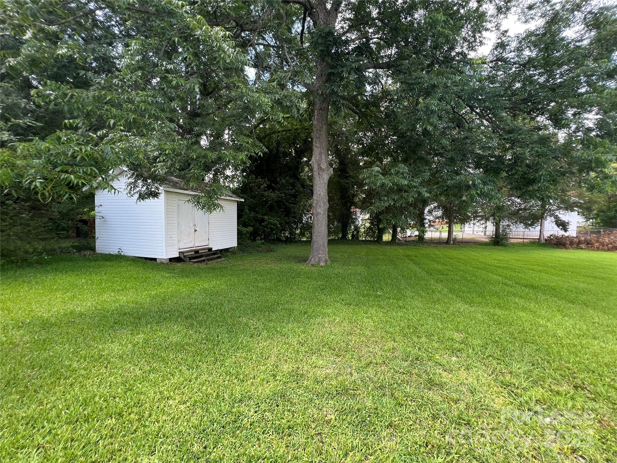 111 East Maryland Avenue Bessemer City, NC 28016 - Photo 11 of 11 a view of a backyard with large trees