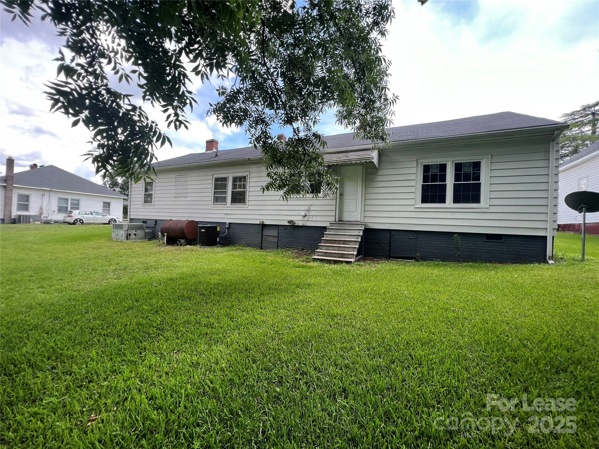111 East Maryland Avenue Bessemer City, NC 28016 - Photo 10 of 11 a view of a house with a backyard