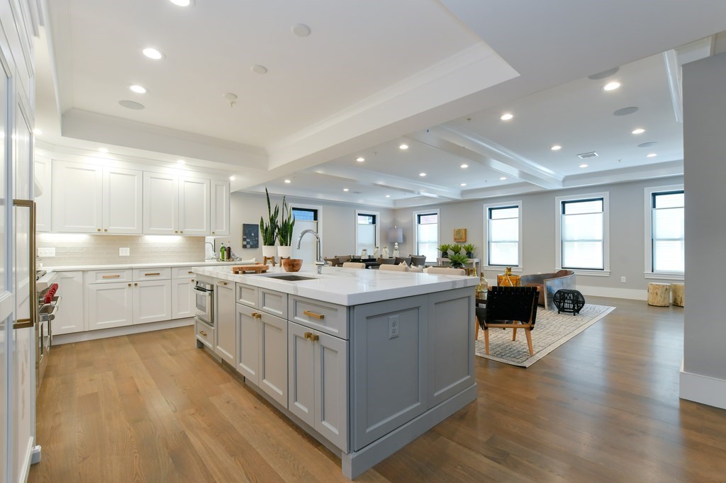 377 West First Street, Unit 2 Boston, MA 02127 - Photo 14 of 39 a kitchen with a sink and wooden floor