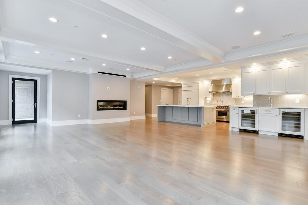 377 West First Street, Unit 2 Boston, MA 02127 - Photo 16 of 39 a view of kitchen with kitchen island white cabinets and stainless steel appliances