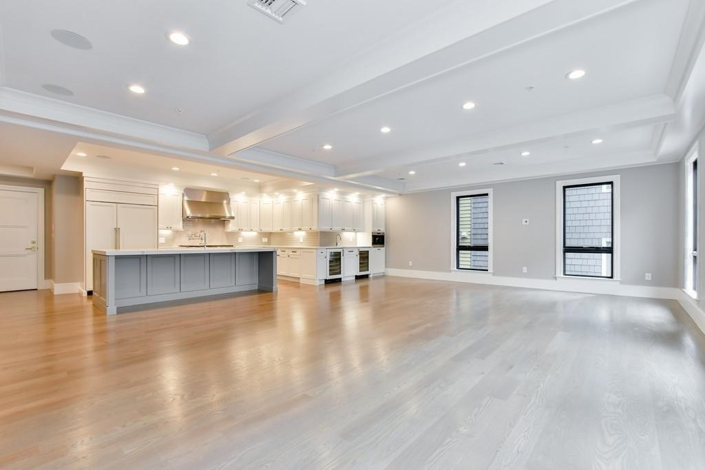 377 West First Street, Unit 2 Boston, MA 02127 - Photo 17 of 39 a view of an empty room with kitchen and window