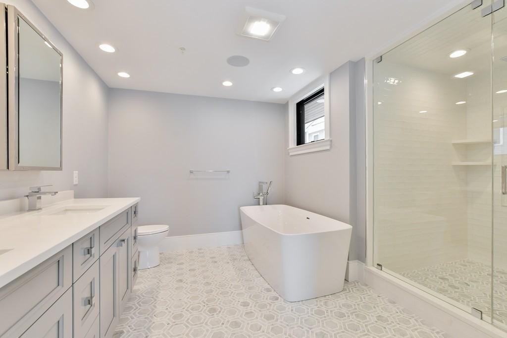 377 West First Street, Unit 2 Boston, MA 02127 - Photo 27 of 39 a bathroom with a toilet a sink and bathtub