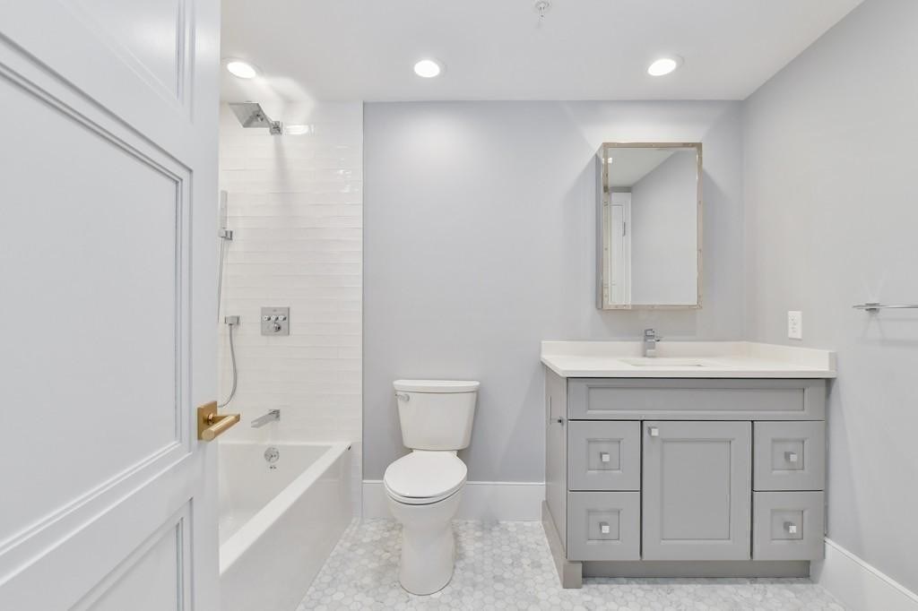 377 West First Street, Unit 2 Boston, MA 02127 - Photo 32 of 39 a bathroom with a sink a toilet and shower