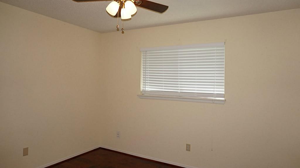 9219 Carousel Lane Houston, TX 77080 - Photo 31 of 31 3rd Bedroom, new ceiling fan, new wood blinds, new laminate floor.