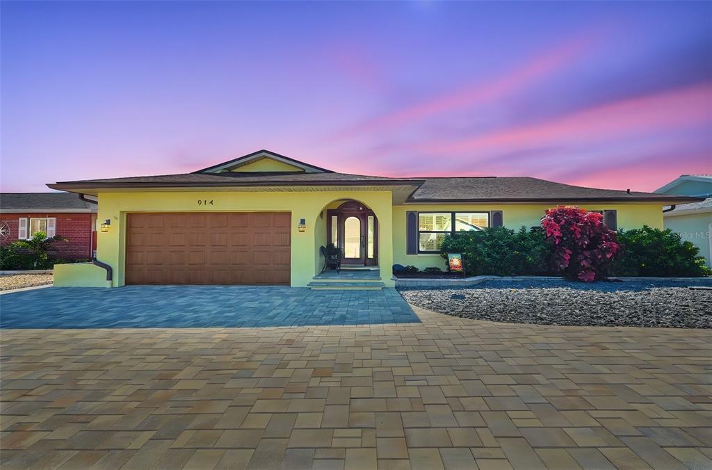 914 Chipaway Drive Apollo Beach, FL 33572 - Photo 30 of 49 a front view of a house with a yard and garage