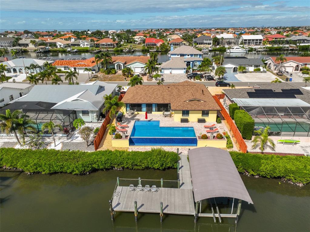 914 Chipaway Drive Apollo Beach, FL 33572 - Photo 3 of 49 an aerial view of a house with garden space and lake view