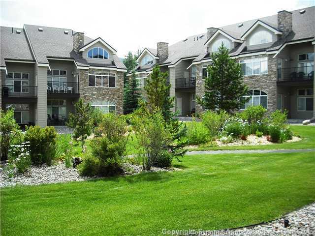 110 Beaver Lodge Road, Unit 103 Frisco, CO 80443 - Photo 14 of 25 a view of a big house with a big yard and potted plants