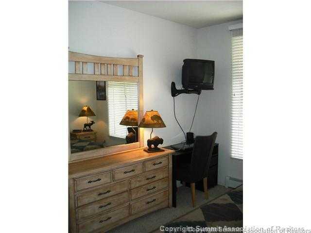 110 Beaver Lodge Road, Unit 103 Frisco, CO 80443 - Photo 17 of 25 a room with furniture and a flat screen tv