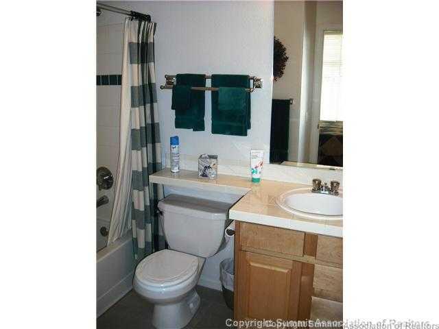 110 Beaver Lodge Road, Unit 103 Frisco, CO 80443 - Photo 18 of 25 a bathroom with a toilet sink and mirror