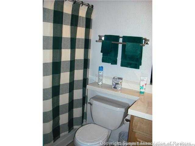 110 Beaver Lodge Road, Unit 103 Frisco, CO 80443 - Photo 19 of 25 a bathroom with a sink a toilet and shower