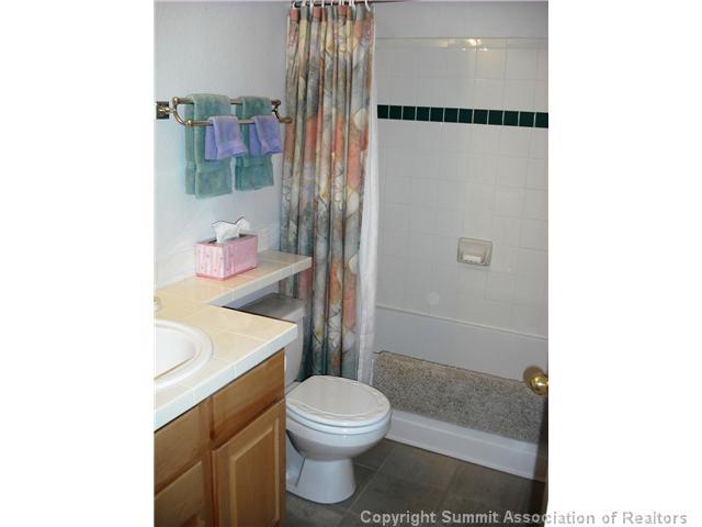110 Beaver Lodge Road, Unit 103 Frisco, CO 80443 - Photo 21 of 25 a bathroom with a toilet a sink and a shower