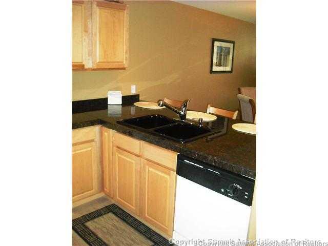 110 Beaver Lodge Road, Unit 103 Frisco, CO 80443 - Photo 9 of 25 a kitchen with a sink and cabinets