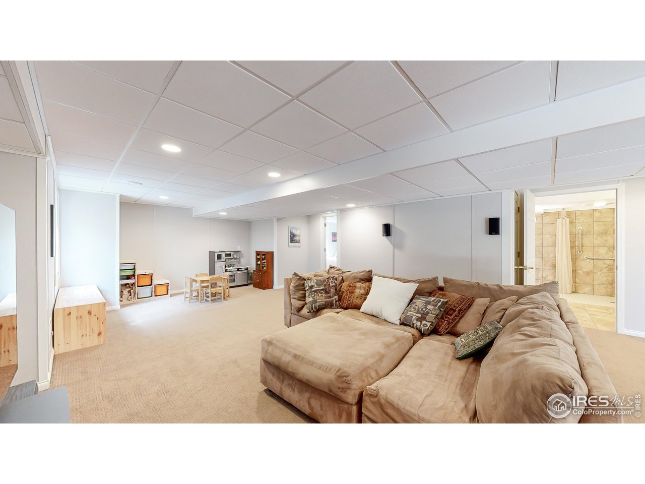 9951 South Spring Hill Place Highlands Ranch, CO 80129 - Photo 23 of 40 a living room with furniture and a large window