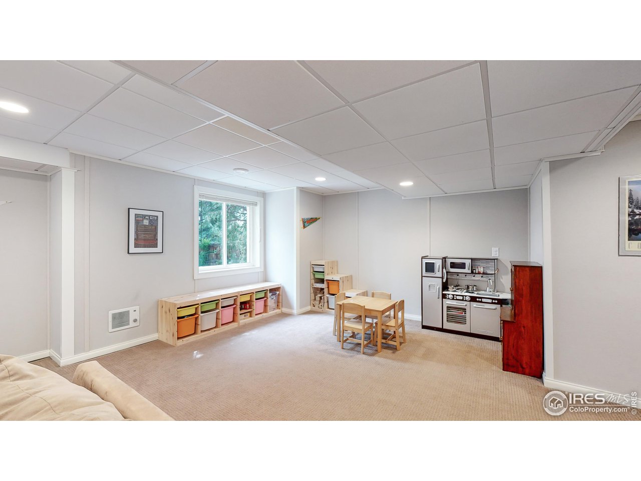 9951 South Spring Hill Place Highlands Ranch, CO 80129 - Photo 24 of 40 a living room with furniture and a flat screen tv