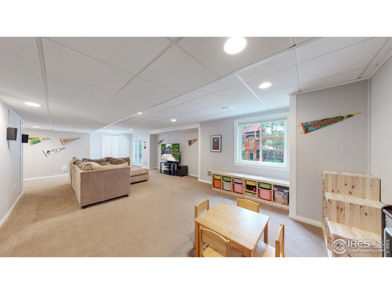 9951 South Spring Hill Place Highlands Ranch, CO 80129 - Photo 25 of 40 a living room with furniture and a flat screen tv