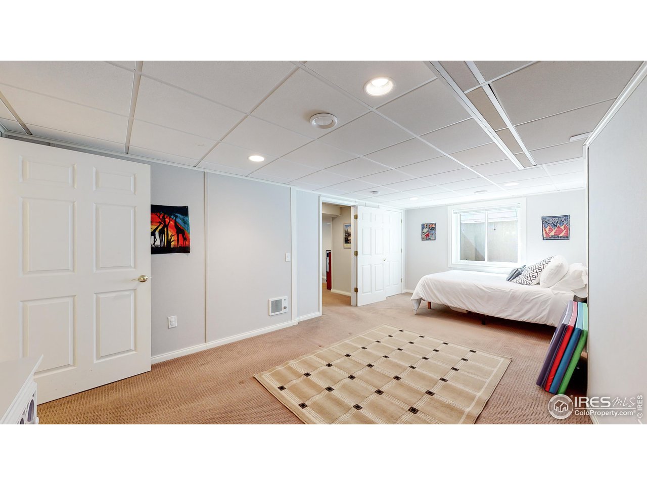 9951 South Spring Hill Place Highlands Ranch, CO 80129 - Photo 26 of 40 a living room with furniture and a flat screen tv