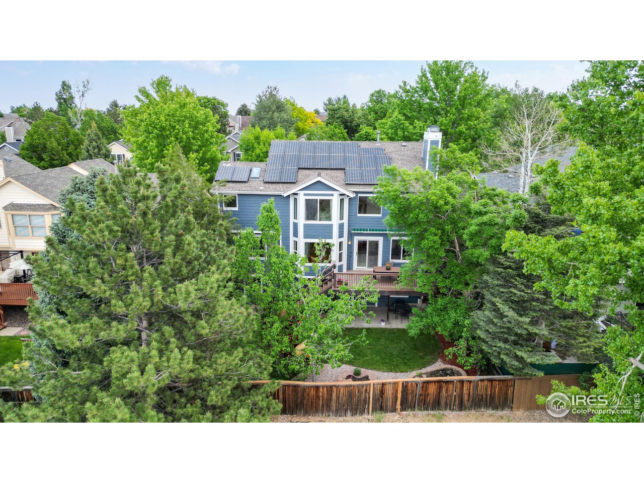 9951 South Spring Hill Place Highlands Ranch, CO 80129 - Photo 31 of 40 a view of a house with a garden