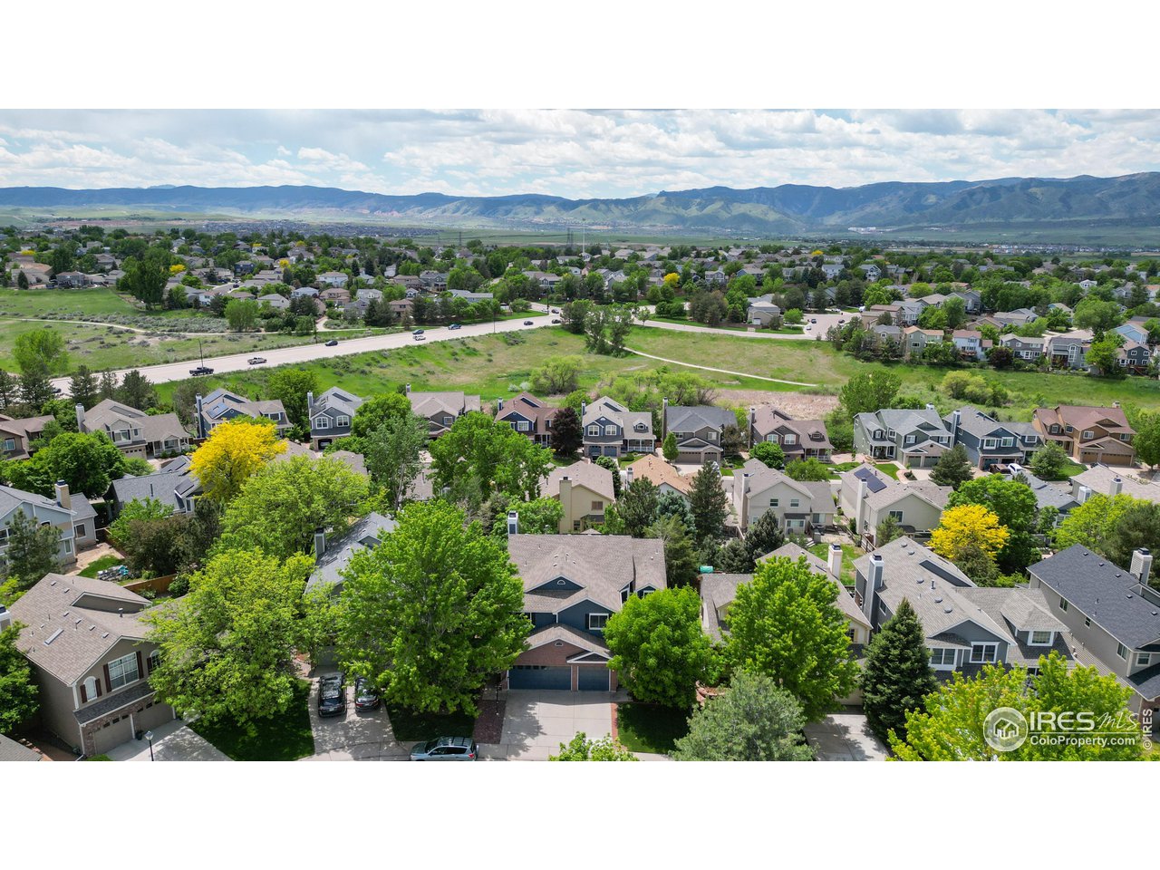 9951 South Spring Hill Place Highlands Ranch, CO 80129 - Photo 36 of 40 a view of a city with mountains in the background