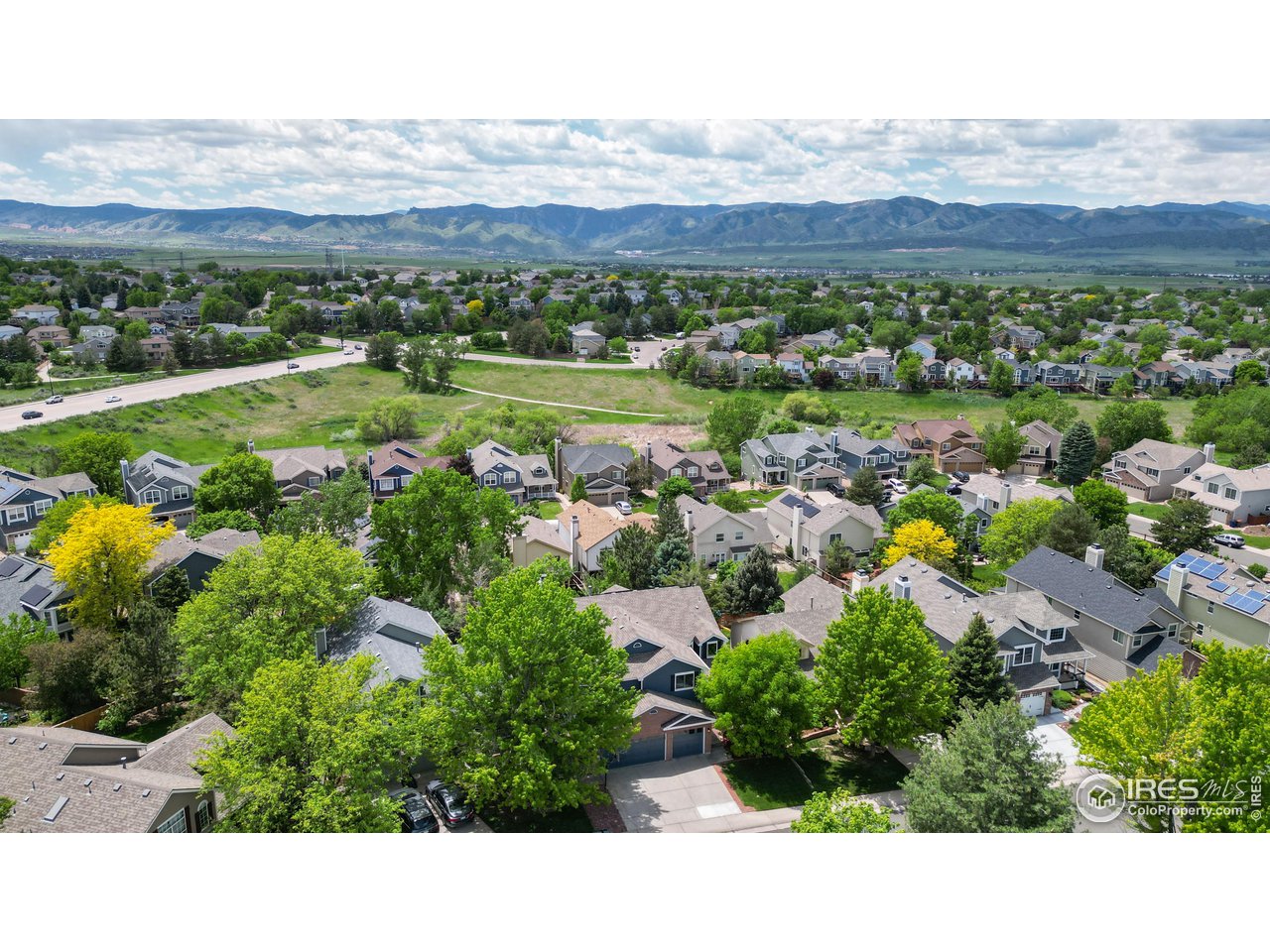9951 South Spring Hill Place Highlands Ranch, CO 80129 - Photo 37 of 40 a view of a city with mountains in the background