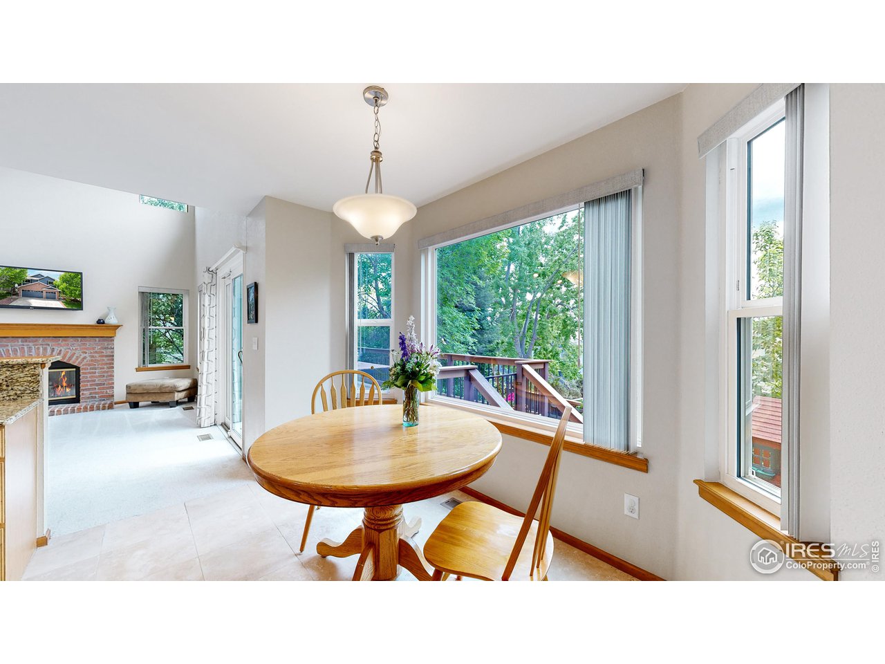9951 South Spring Hill Place Highlands Ranch, CO 80129 - Photo 6 of 40 a living room with furniture and a table