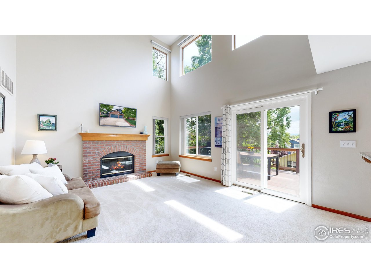 9951 South Spring Hill Place Highlands Ranch, CO 80129 - Photo 7 of 40 a living room with furniture and a fireplace