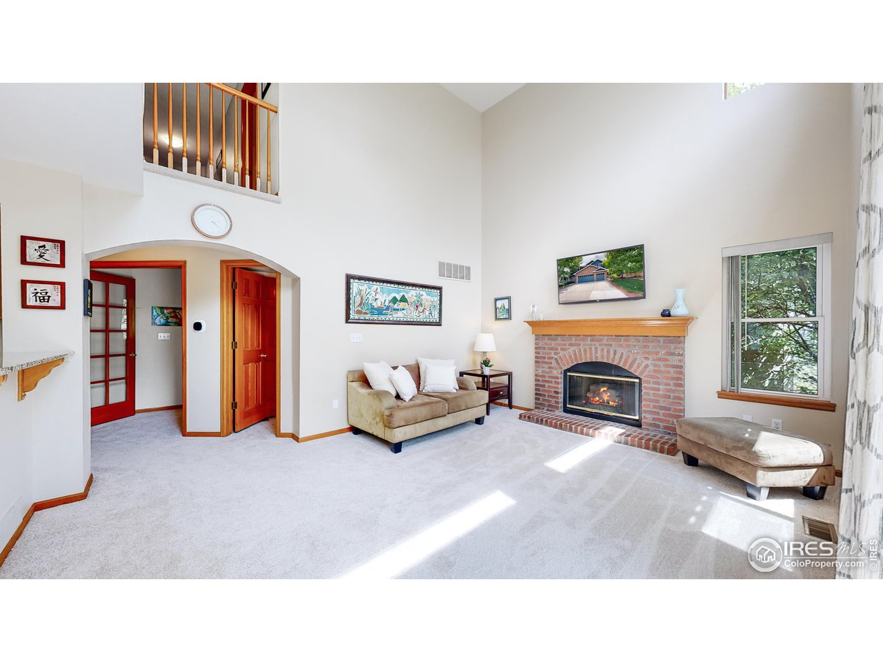 9951 South Spring Hill Place Highlands Ranch, CO 80129 - Photo 8 of 40 a living room with furniture and a fireplace