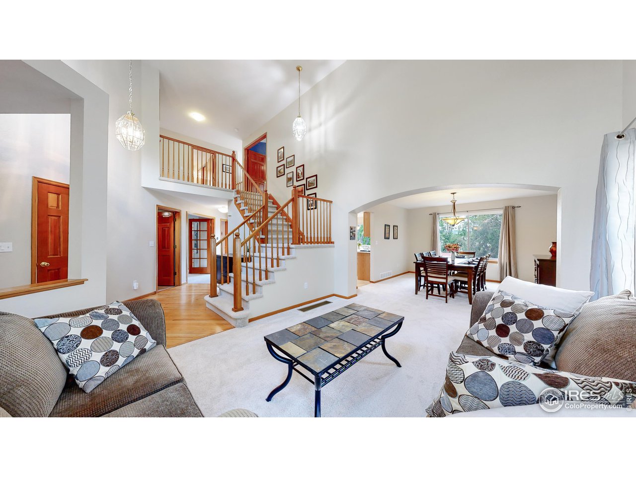 9951 South Spring Hill Place Highlands Ranch, CO 80129 - Photo 40 of 40 a living room with furniture and wooden floor