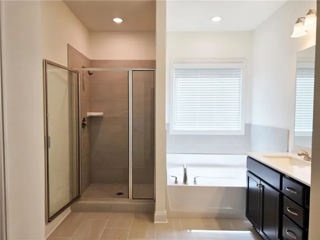 a bathroom with a bathtub and a sink