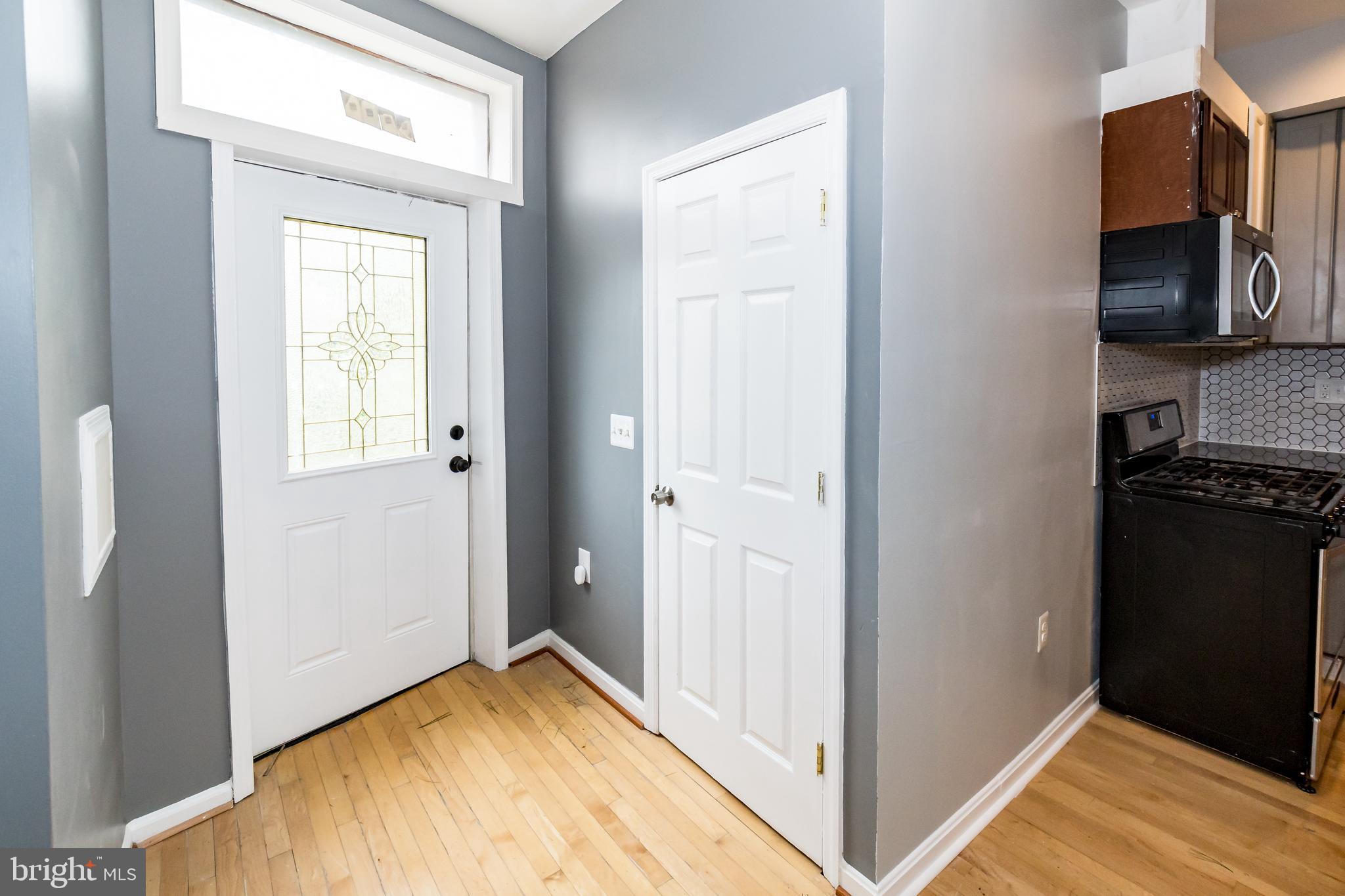 1427 New Jersey Avenue Northwest Washington, DC 20001 - Photo 23 of 29 a view of a hallway with wooden floor and a bathroom