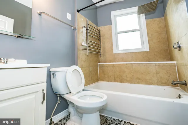 a bathroom with a sink toilet and bathtub