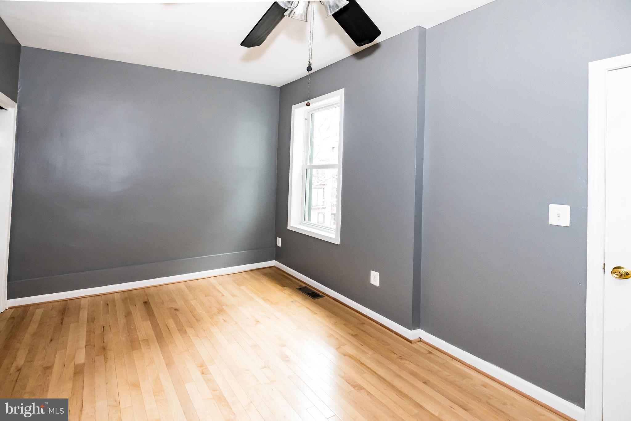 1427 New Jersey Avenue Northwest Washington, DC 20001 - Photo 10 of 29 wooden floor in an empty room with a window
