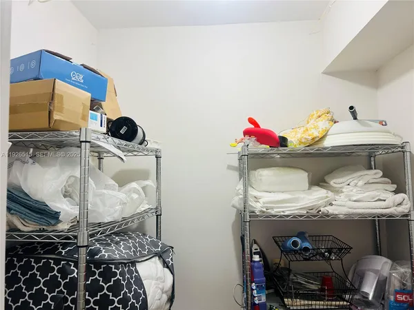 a bathroom with a glass shower door and a mirror