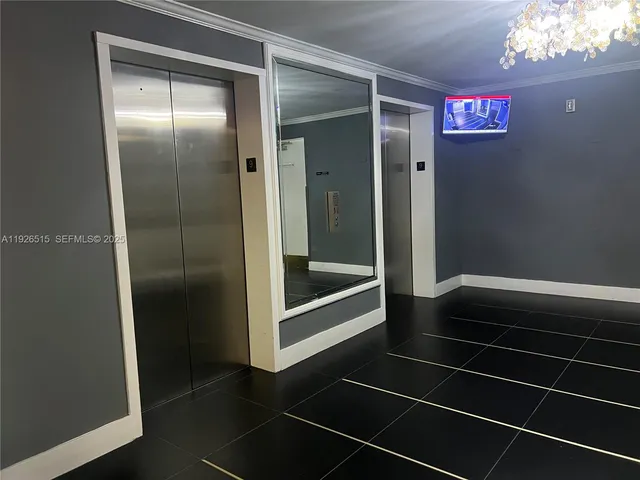 a view of living room with furniture and a fireplace