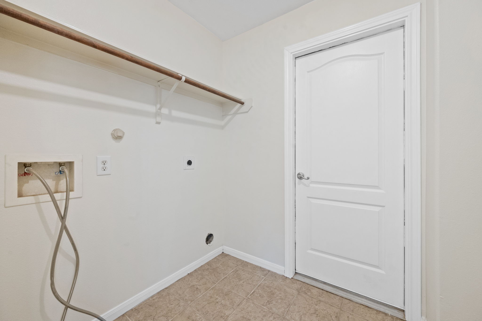 25785 Hickory Lane Splendora, TX 77372 - Photo 17 of 28 a view of small space with racks on the wall and a window