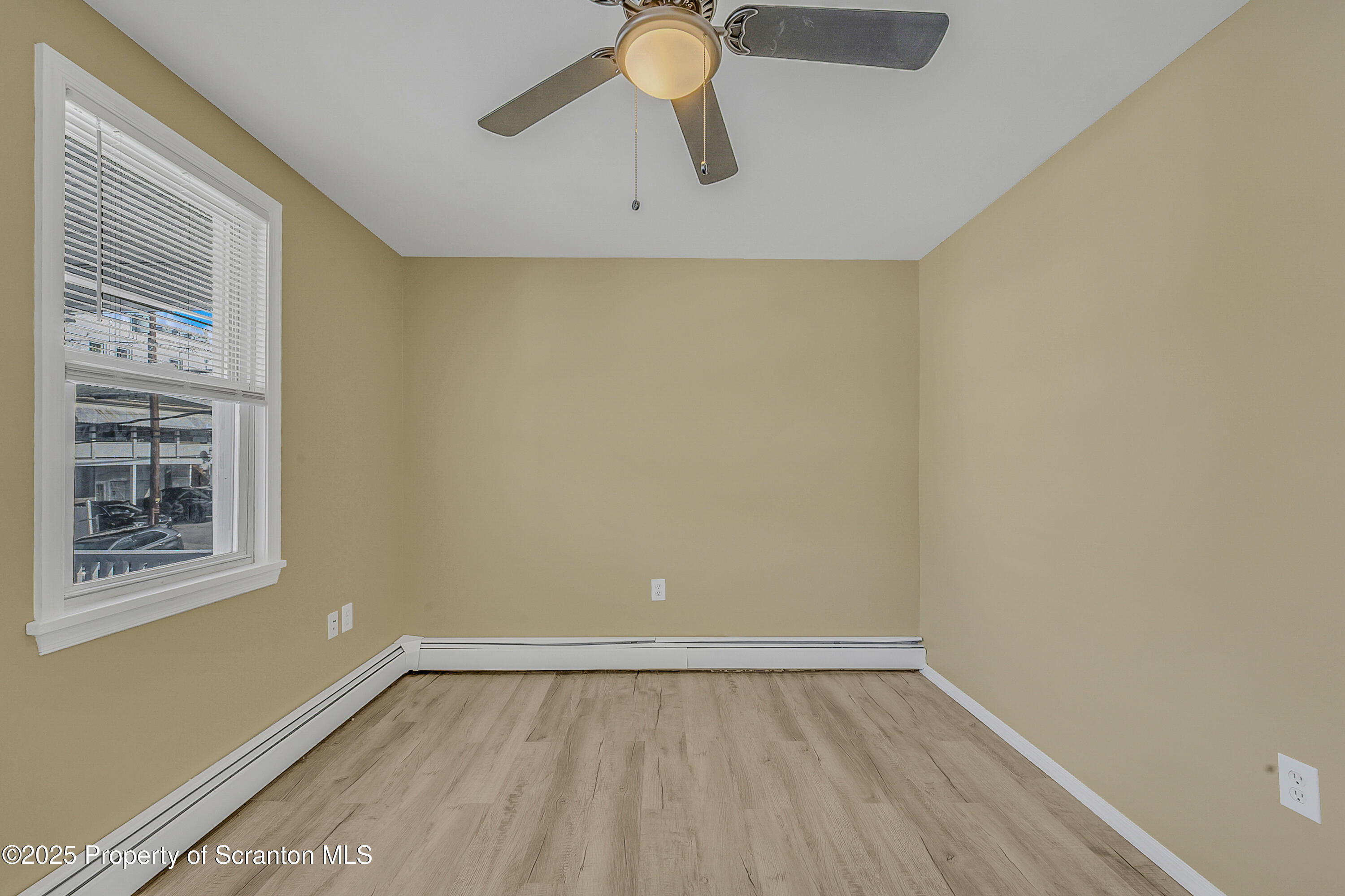 538 Birch Street, Unit 3 Scranton, PA 18505 - Photo 12 of 18 a view of an empty room with wooden floor and a window
