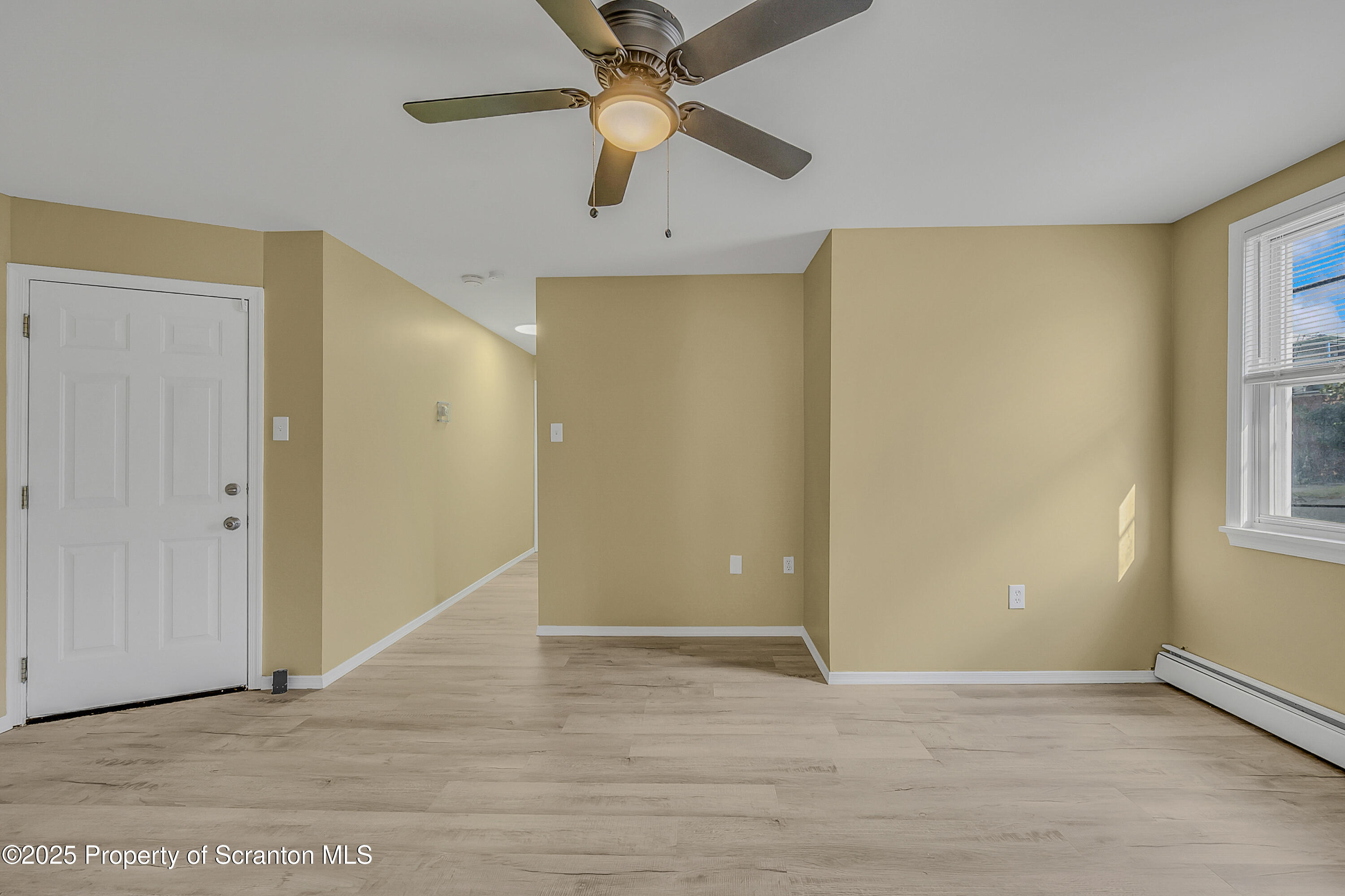 538 Birch Street, Unit 3 Scranton, PA 18505 - Photo 5 of 18 an empty room with windows and fan