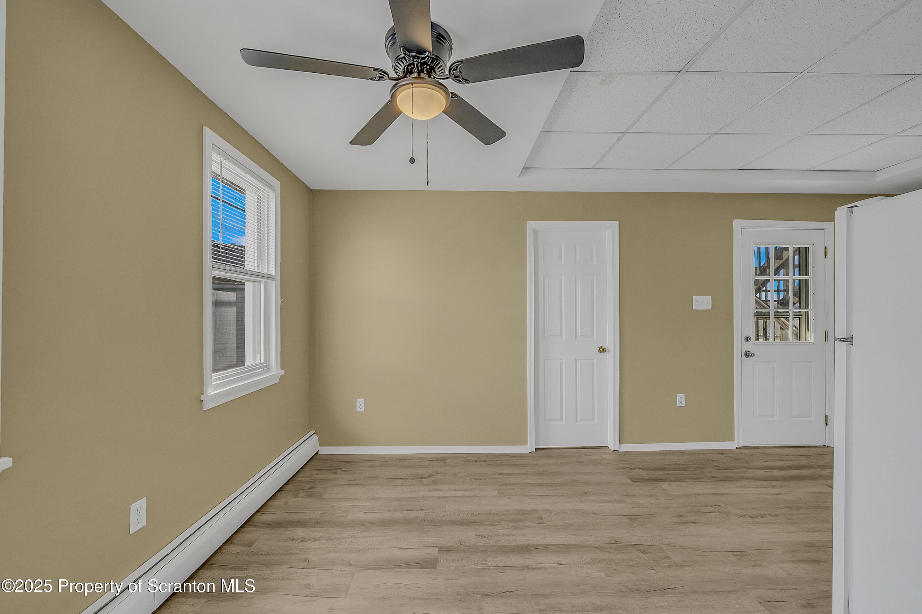 538 Birch Street, Unit 3 Scranton, PA 18505 - Photo 7 of 18 a view of an empty room with window and wooden floor