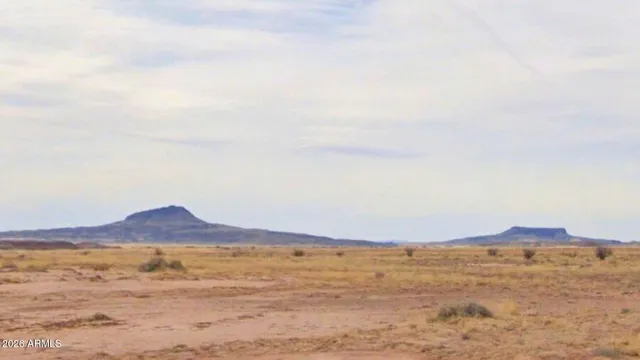 a view of an ocean and a mountain