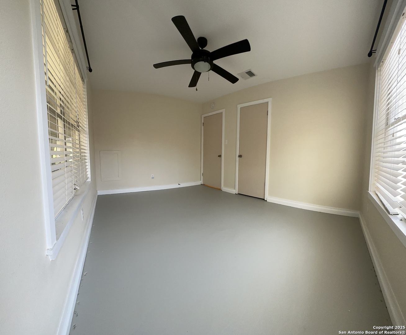 311 Tagert Street Pleasanton, TX 78064 - Photo 3 of 6 a view of room with a ceiling fan and window