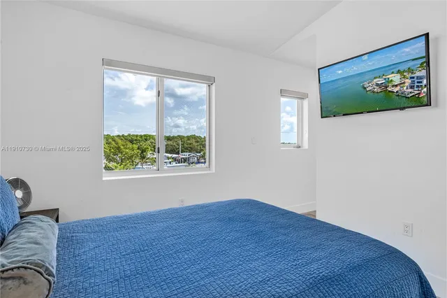 a view of a livingroom with furniture and windows