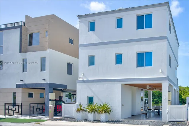 a front view of a building with garden