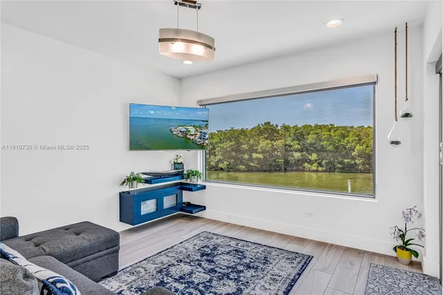 a living room with a couch and a window