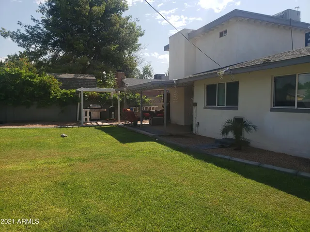 a view of a backyard of the house