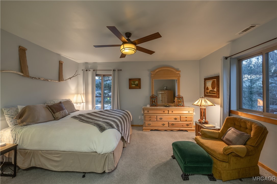 448 Edgemoor Road Big Bear Lake, CA 92315 - Photo 27 of 42 a bedroom with furniture and a large window