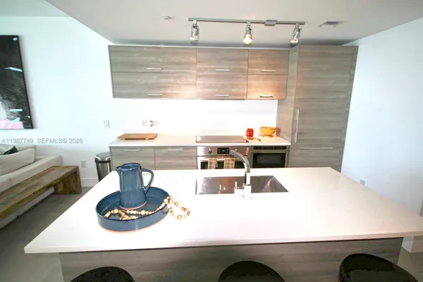 a living room with furniture rug and window