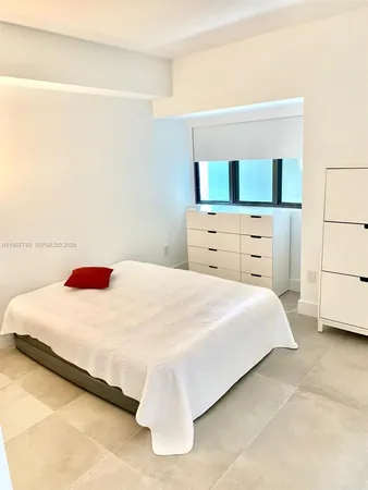 a kitchen with a table and chairs