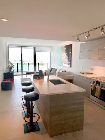 a lobby with furniture and a window