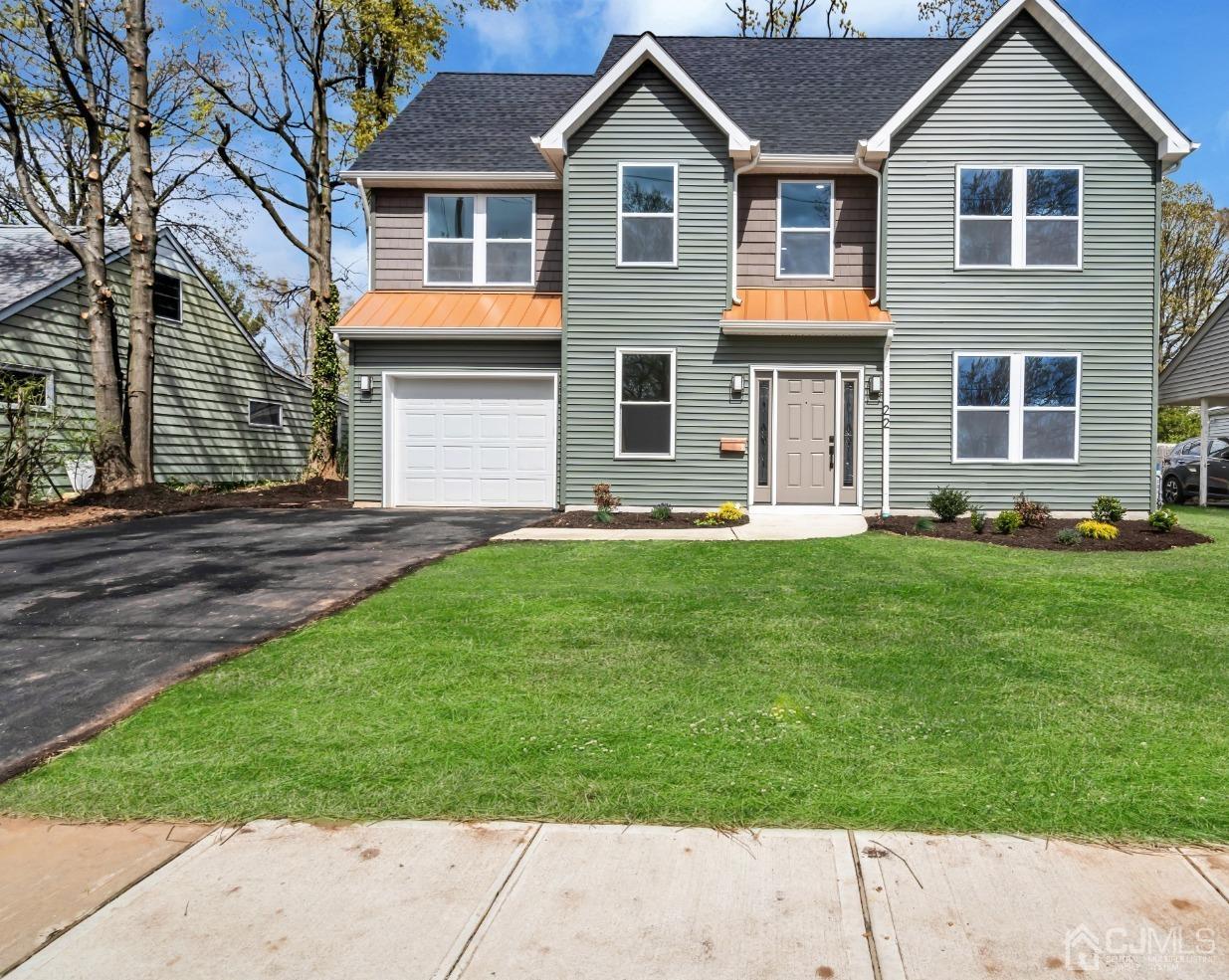 22 Stiles Road Edison, NJ 08817 - Photo 2 of 48 a front view of a house with a yard and trees