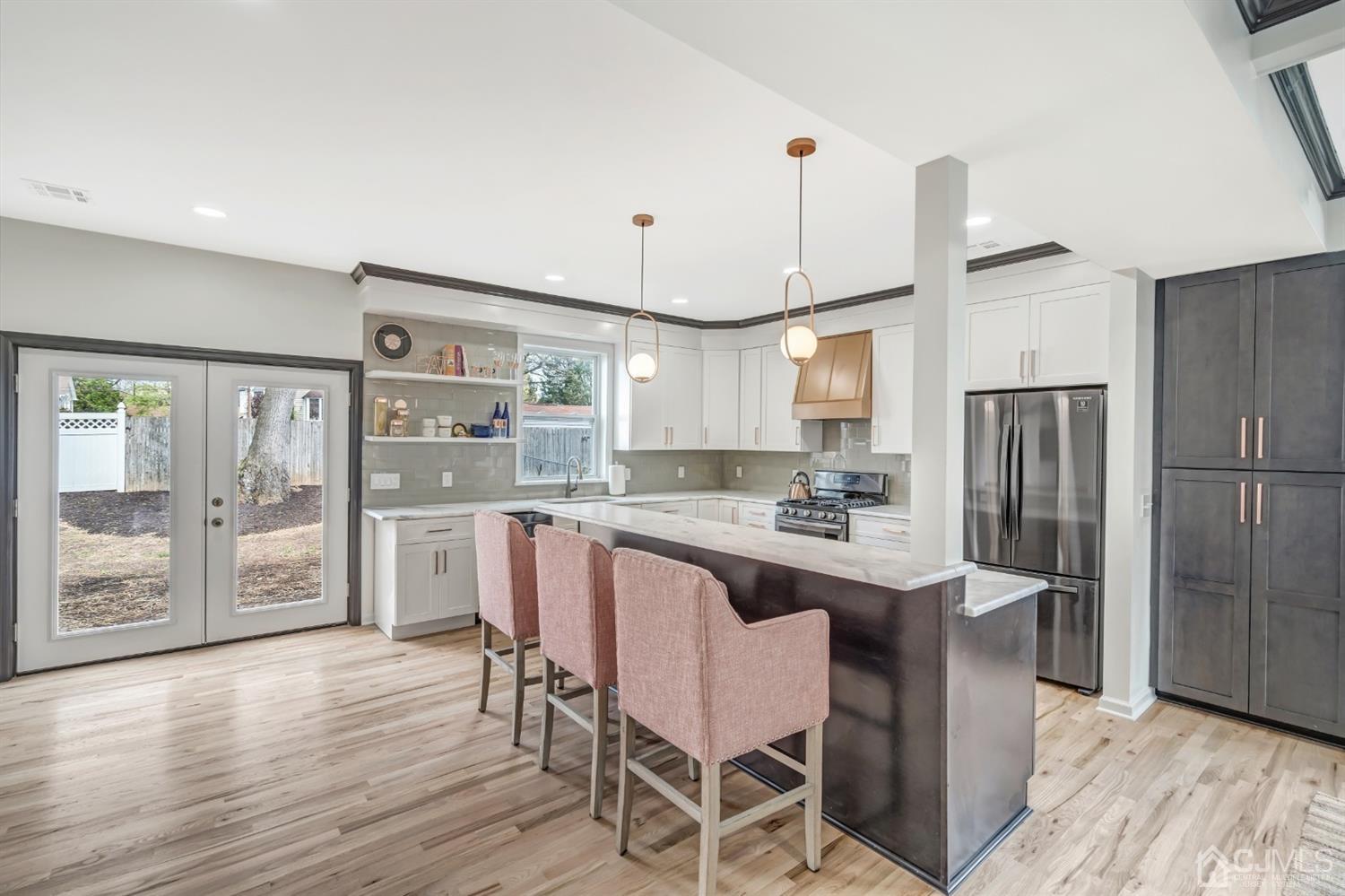 22 Stiles Road Edison, NJ 08817 - Photo 14 of 48 a kitchen with refrigerator and wooden floor